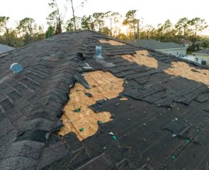 Natural disaster and its consequences. Hurricane Ian destroyed house roof in Florida residential area.